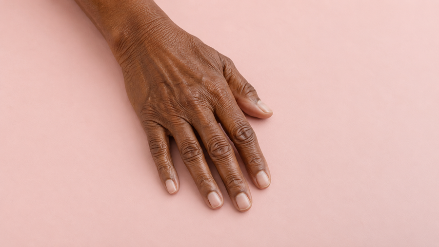 A hand with natural short unpolished nails